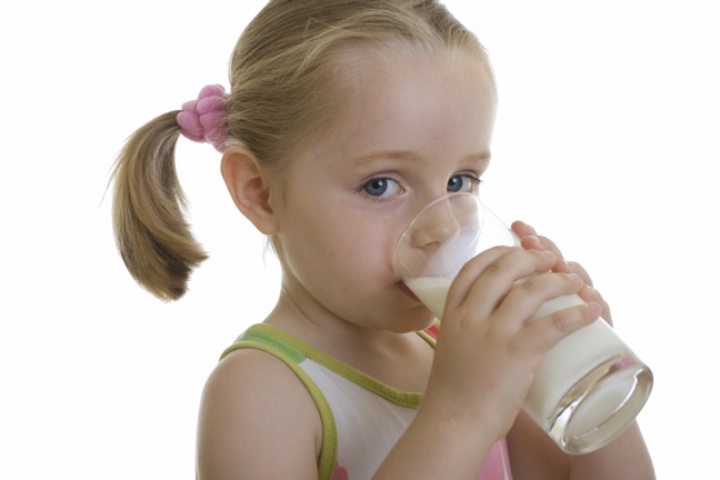 Little girl drinking milk