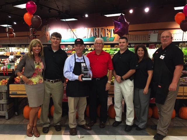 Congressman Bill Johnson accepts the Champion of Independent Grocers Award from the Graff family. From left are Pam and Bob Graff, Johnson, Ron Graff Sr., Ron Graff Jr. and Jennifer Graff and store manager Buddy Robinson.