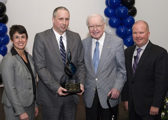 David Cooper, store manager of the Food Lion in Raleigh, North Carolina, accepts the grocer's 2015 Store Manager of the Year Award. Pictured are Food Lion President Meg Ham, Cooper, Food Lion founder Ralph Ketner and Food Lion SVP of of Retail Operations Greg Finchum.