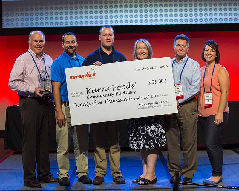 Representing Karns Quality Foods, from left, Scott Karns, president and CEO; Todd Keys, meat department manager; and Mat Rudderow, VP of procurement; Supervalu Foundation President Mary Vander Leest; and Lee Halula, director category management, and Nicole Murdoch-Cowden, bakery supervisor, Karns. 