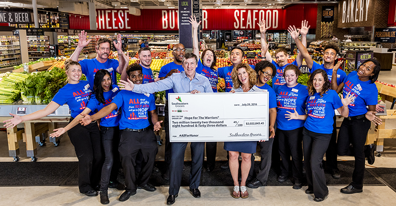 Southeastern Grocers President and CEO Ian McLeod presented Hope For The Warriors co-founder, President and CEO Robin Kelleher with $2,022,843.45, the nonprofit’s single largest donation to benefit veterans, service members and military families from the grocer’s All For Honor campaign.