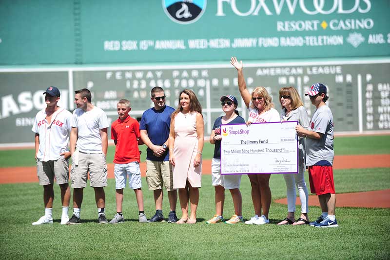 Members of Stop & Shop came together with families and members of The Jimmy Fund and Dana-Farber Cancer Institute for the check donation at Boston's Fenway Park.