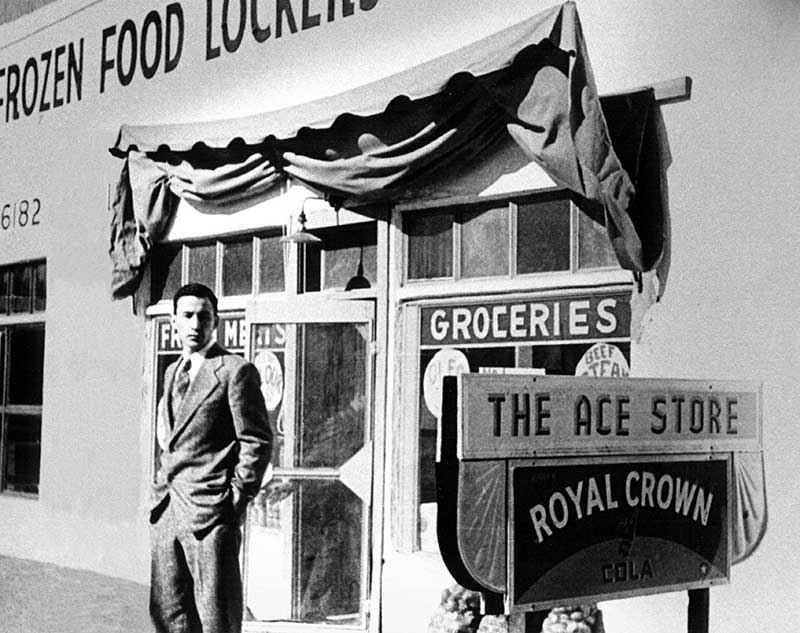 Joe Baca in front of the family’s Ace Food Store. Bueno Foods started out as a small neighborhood grocery store, but after big stores came in it was forced to innovate and Bueno Foods was born.