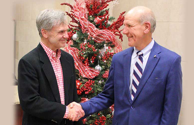 Logan McCabe, Bristol Motor Speedway's VP of consumer marketing,and Food City President and CEO Steve Smith.