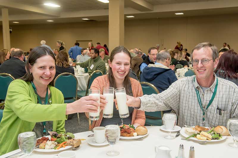 Farmers raise a milk toast during the Vermont Dairy Producers Conference, held at the Sheraton Hotel in Burlington.