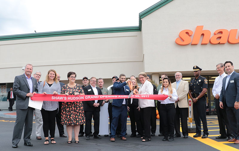 Hudson Shaw's Store Director Brian Michaud leads the ribbon cutting.