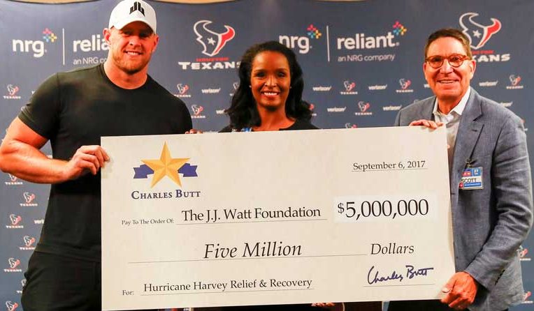 NFL star JJ Watt with Winell Heron and Scott McClelland, H-E-B.