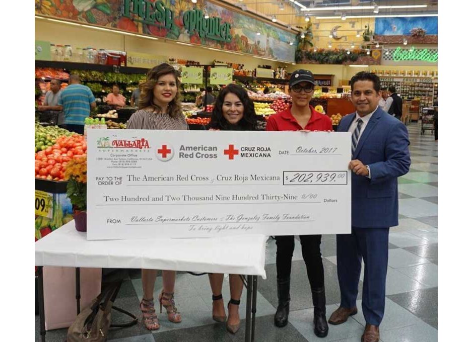 Check presentation to American Red Cross and Cruz Roja Mexicana. Left to right: Ruby Martinez, marketing manager, and Diana Garci, marketing coordinator, Vallarta; Norma Vega, American Red Cross; and Castillo.