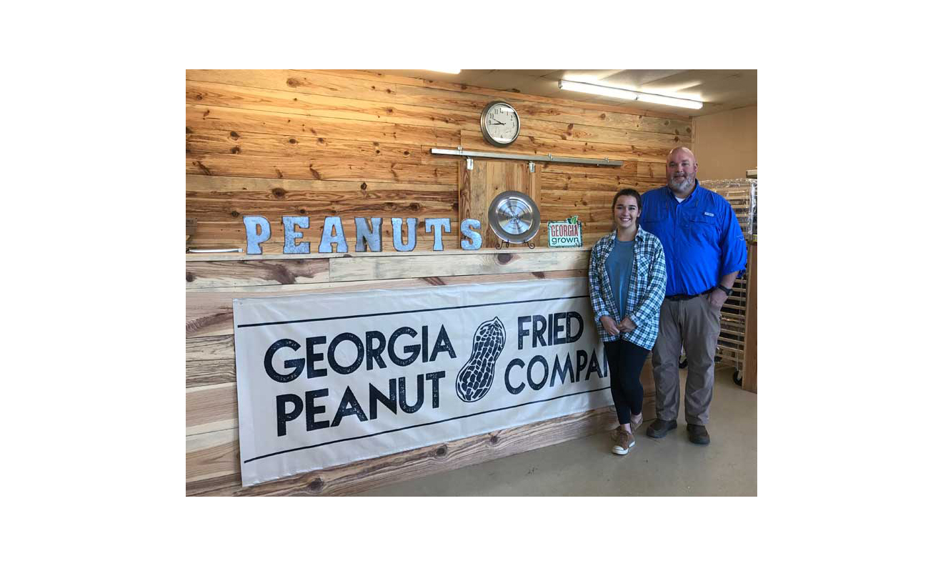 John West and his daughter, Taylor. She runs Georgia Fried Peanut Co. along with three other employees.