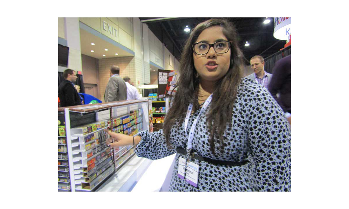 Rimsha Baig of Mars Wrigley with a miniature store display that illustrates the ideal candy aisle layout.