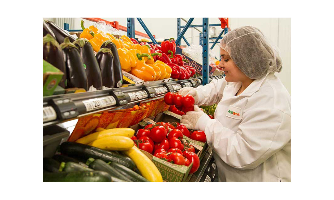 A picker at FreshDirect's new campus