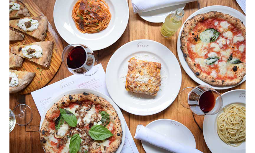 A table holding Italian dishes