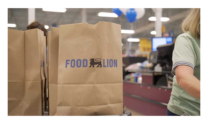 A closeup of a Food Lion shopping bag at checkout, savings