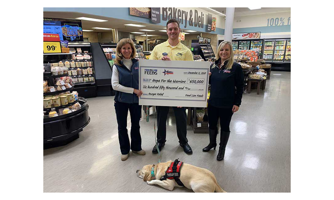 Left to right, Robin Kelleher, president and CEO of Hope For The Warriors; Chris Ortiz, Food Lion execution implementation specialist; Karen Lee, VP of strategic communications for Hope For The Warriors; and LuLu, Hope For The Warriors therapy dog.