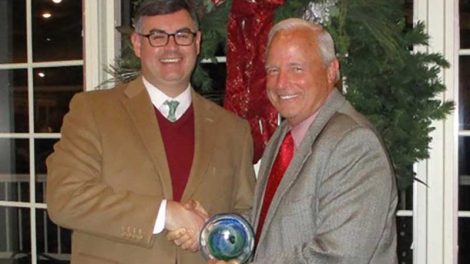 NGA EVP Greg Ferrara, left, receives the Government Affairs Partnership Award from Jon McCormick, president and CEO of RGA/KFDA.