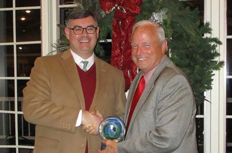 NGA EVP Greg Ferrara, left, receives the Government Affairs Partnership Award from Jon McCormick, president and CEO of RGA/KFDA.