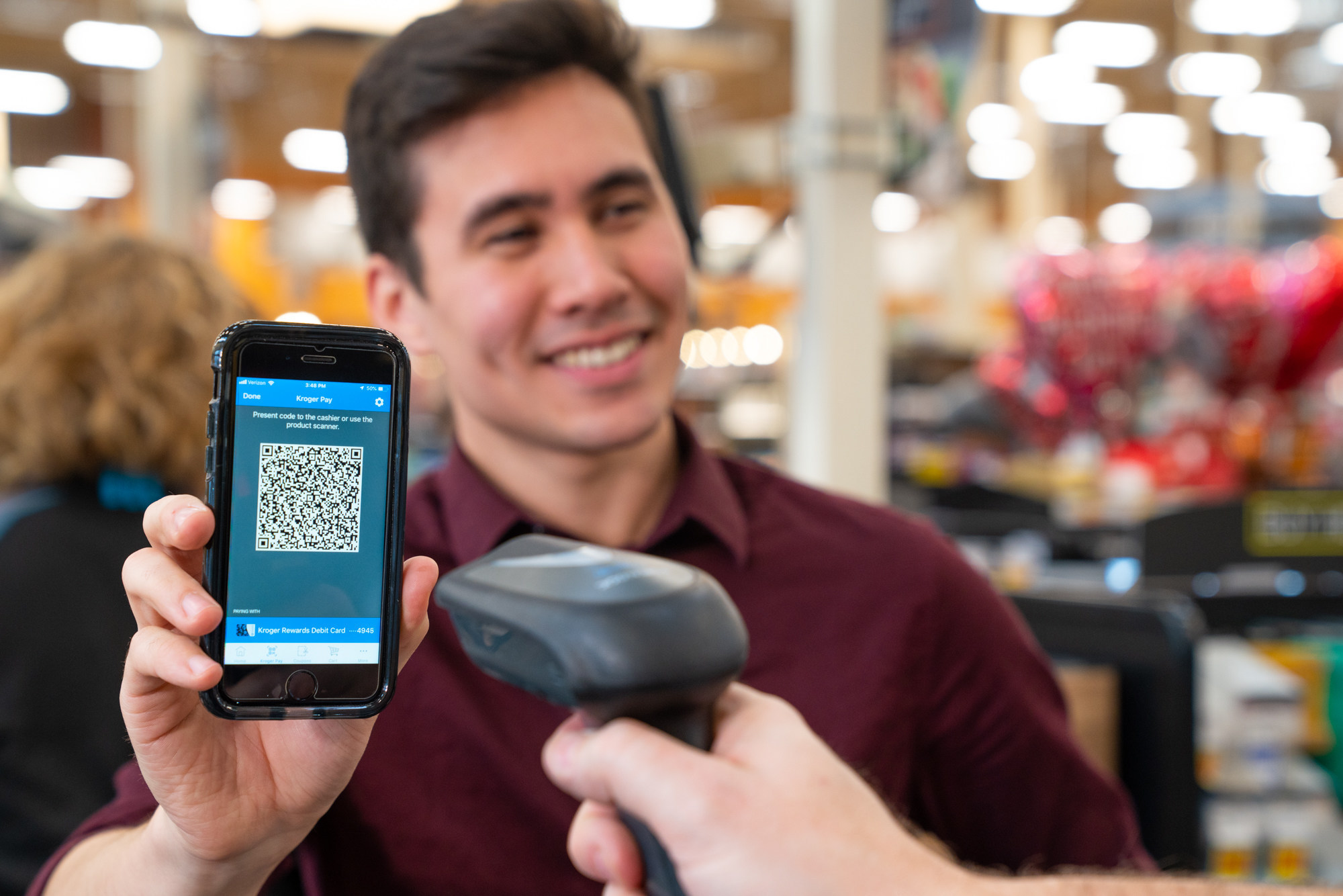 A man using Kroger Pay at checkout