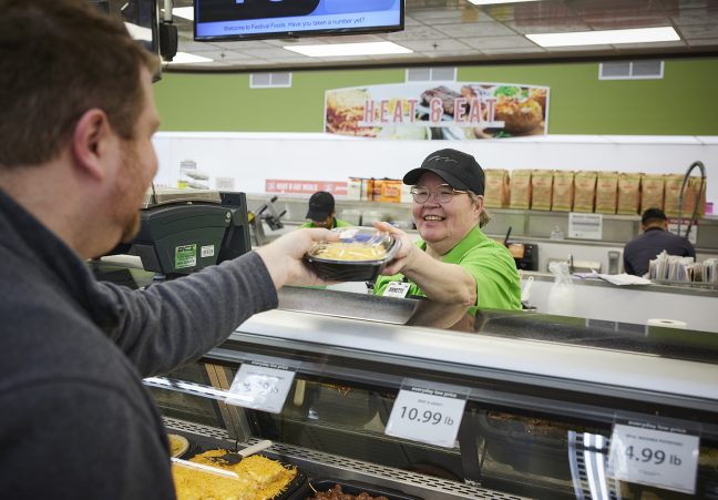 Festival Foods employee serving fresh food at store