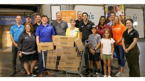 Representatives from Smithfield Foods and Kroger join together to donate 30,000 pounds of protein to Gleaners Food Bank of Indianapolis.