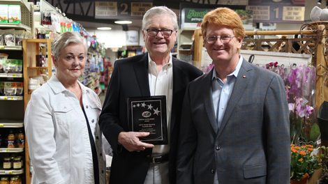 Foothills IGA accepting the Spirit of IGA award from John Ross, president and CEO.