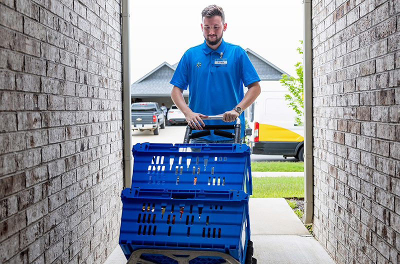 Walmart delivery driver dropping off purchases