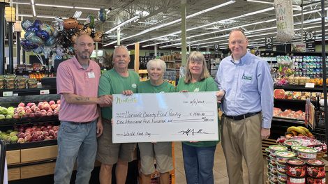 Fresh Encounter presents a check to a local food bank