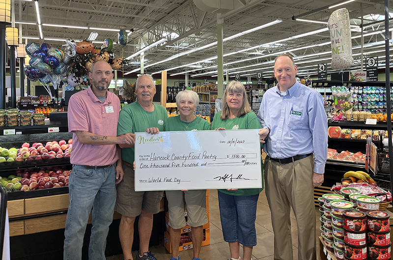 Fresh Encounter presents a check to a local food bank