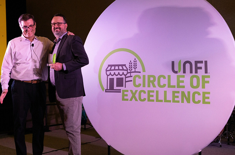 Natural Grocer accepted the Circle of Excellence award at the UNFI Circle of Excellence ceremony.