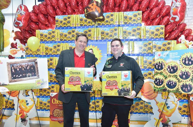 ShopRite of Wayne Store Manager Rob Wilson with Inserra Supermarkets associate James Steed and special-edition Cheerios boxes in background.