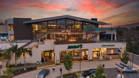 Drone photo of Jimbo's store with sunset in background