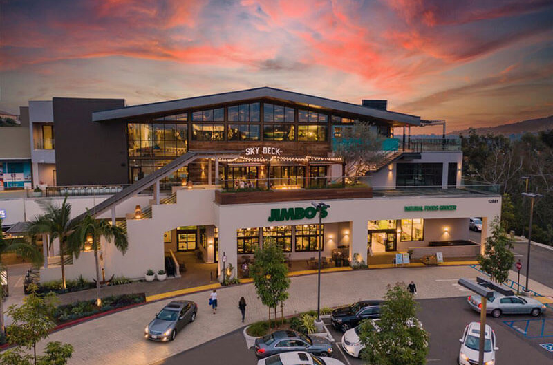 Drone photo of Jimbo's store with sunset in background