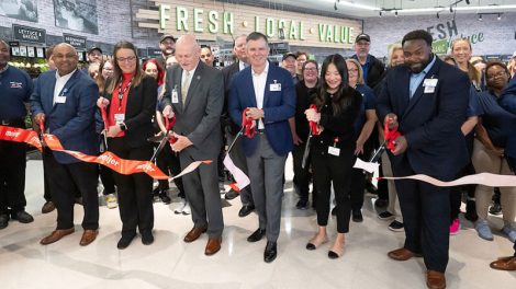 Cutting ribbon at new Meijer North Canton store