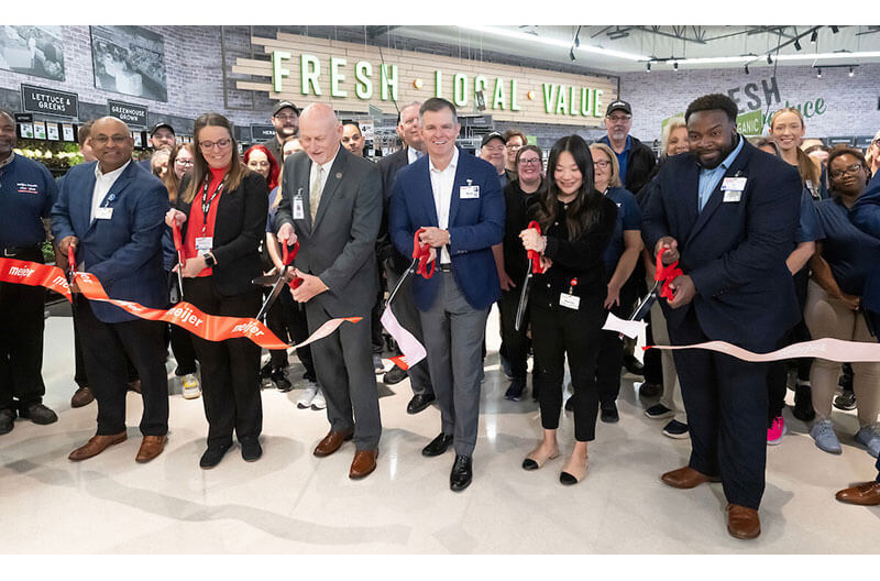 Cutting ribbon at new Meijer North Canton store