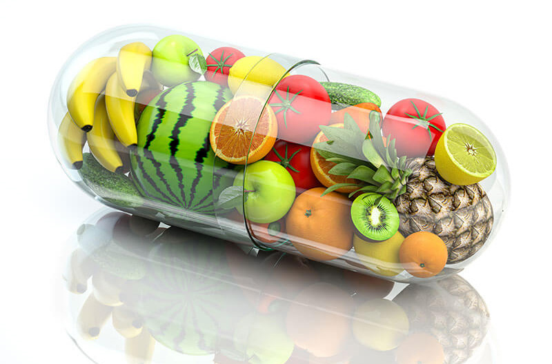 Image of fruits and vegetables inside a clear capsule for food as medicine