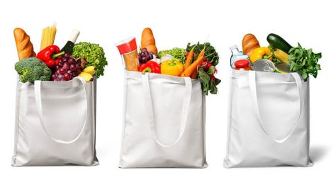 A variety of grocery items in reusable bags to illustrate nutrition policies in Farm Bill