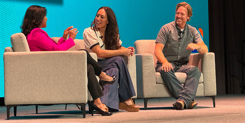 Photo of Eva Saha talking with Joanna and Chip Gaines onstage at the 2024 IDDBA Show