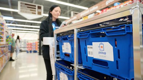 Image of Meijer employee with online order bins