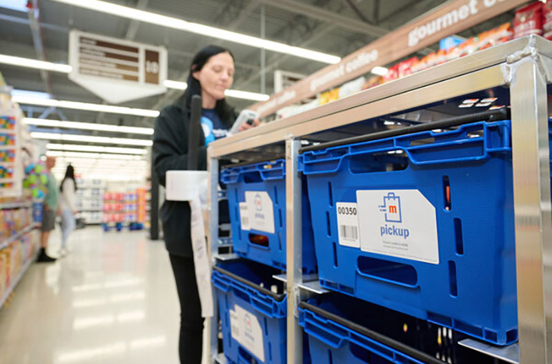 Image of Meijer employee with online order bins