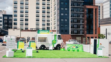 Photo of Publix ice cream truck set up in front of downtown buildings