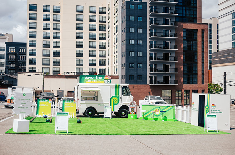 Photo of Publix ice cream truck set up in front of downtown buildings