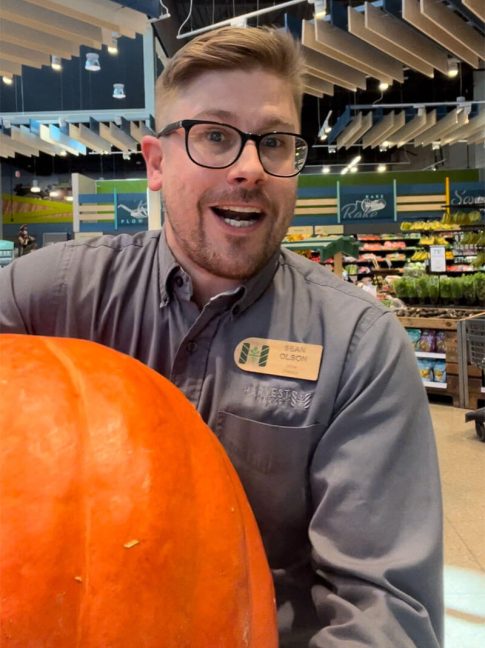 photo of Sean Olson holding a pumpkin