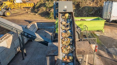 image of depackaged food on Denali company's conveyor belt