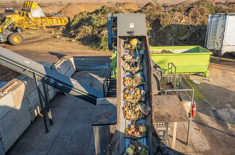 image of depackaged food on Denali company's conveyor belt