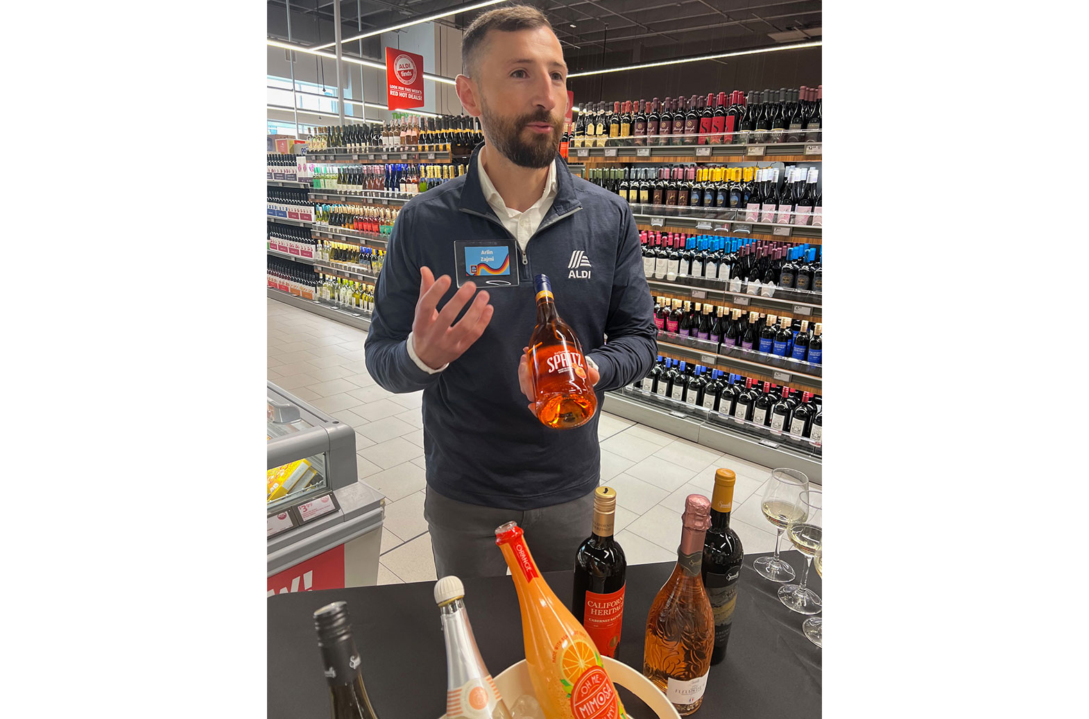 image of Arlin Zajmi in Aldi wine aisle