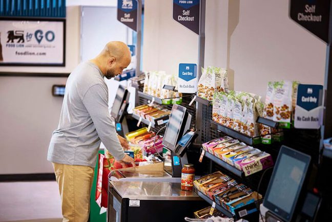 image of Food Lion customer using self-checkout