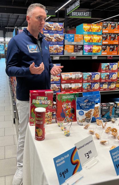 image of Shaun O'Keefe in front of table with Aldi private label products