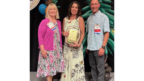 MGA President Jamie Pfuhl, Kris Kowalski Christiansen, and MGA Board Chair Chris Quisberg