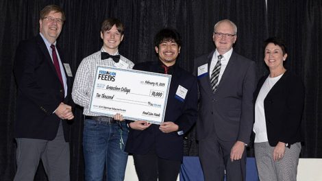 image of Food Lion Feeds student hunger ambassador with company officials