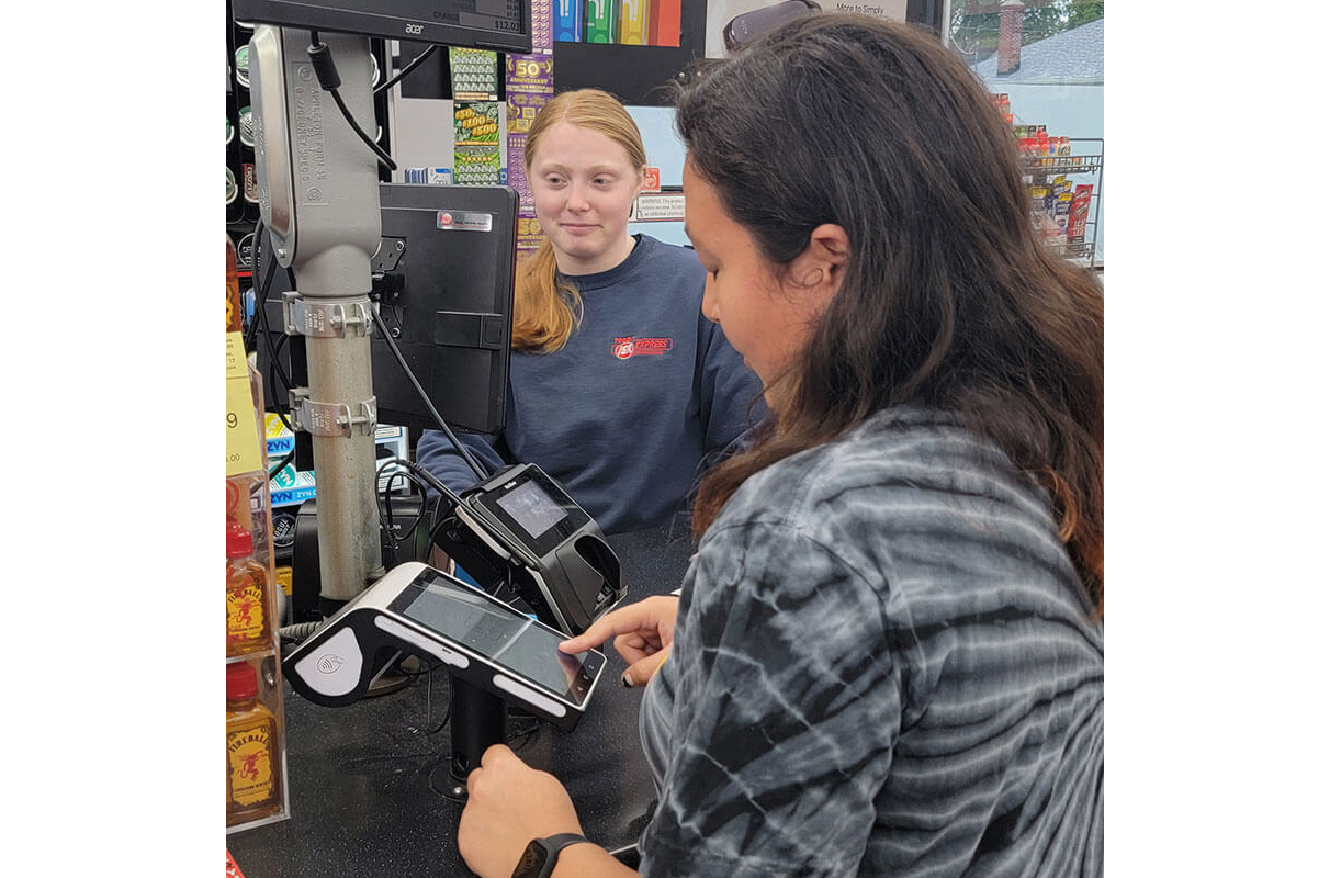 image of customer are register in store served by Laurel Grocery