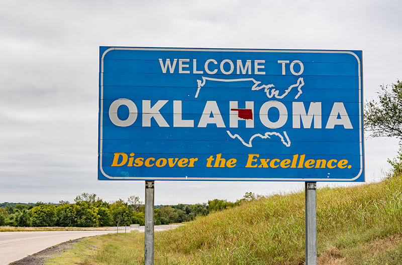 image of Welcome to Oklahoma sign on highway